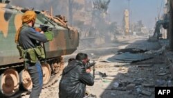 Turkey-backed Syrian opposition fighters take positions during their advance on the city of Al-Bab on February 22.