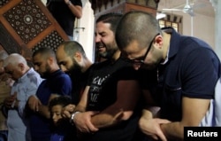 Relatives of the victims of the missing EgyptAir flight MS804 hold an absentee funeral prayer in a mosque nearby Cairo airport, in Cairo on May 20.