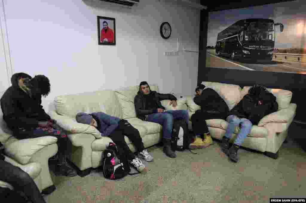 Refugees rest in a bus station in Edirne, Turkey, on March 1, as they wait and hope to enter Greece.
