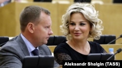 Denis Voronenkov and his wife, Maria Maksakova, attend a State Duma session in Moscow on June 8.