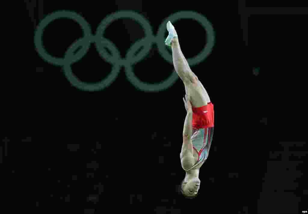 Uladzislau Hancharou of Belarus competes in the men's trampoline qualifications.