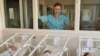 Precious youth: A nurse watches over newborns at a Moscow maternity hospital. (file photo)