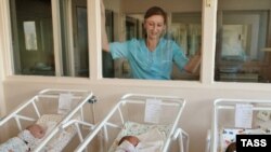 Precious youth: A nurse watches over newborns at a Moscow maternity hospital. (file photo)