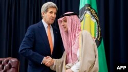 Saudi Foreign Minister Adel al-Jubeir (right) shakes hands with U.S. Secretary of State John Kerry on January 23.