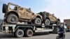 Vehicule militare NATO transportate în Afghanistan