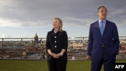 Russian Foreign Minister Sergei Lavrov (right) and U.S. Secretary of State Hillary, posing for photos in St. Petersburg back in June, say the new agreements are further proof of growing cooperation.