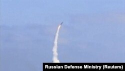 A still image taken from a video footage and released by Russian Defense Ministry on September 5, shows the Russian frigate Admiral Essen in the Mediterranean Sea firing a Kalibr cruise missile at Islamic State targets near the Deir al-Zor.