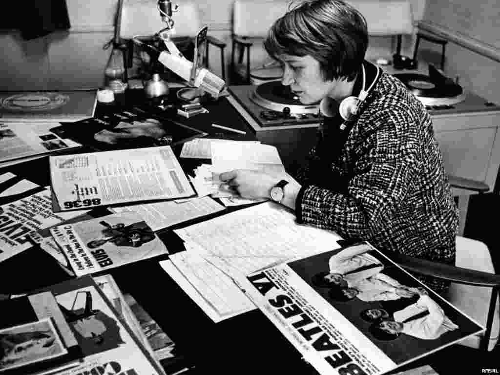 A broadcaster prepares a music program, 1960s. 