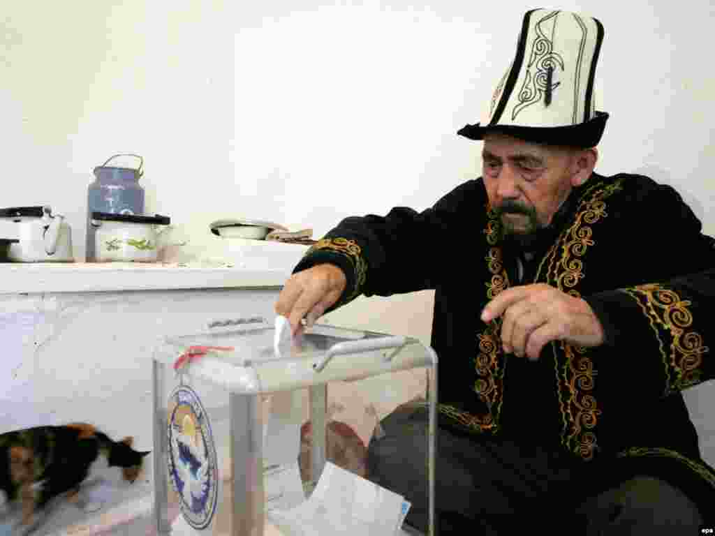 A Kyrgyz man votes on October 10 in elections to replace the interim government. The polls were aimed at forming the first parliamentary democracy in Central Asia in the wake of a violent uprising earlier in the year. Photo by Igor Kovalenko for epa