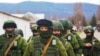 Ukraine – Russian military forces invaded Crimea peninsula. Russian soldiers (faces) in Perevalne, Crimea, March 5, 2014