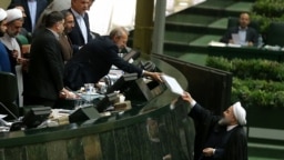 Iran: Hassan Rouhani , Iran`s President, gave next year budget to Ali Larijani , Speaker of parliament.
