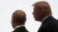 Russian President Vladimir Putin (left) and U.S. President Donald Trump walk together during a G20 leaders summit in Japan in 2019. 