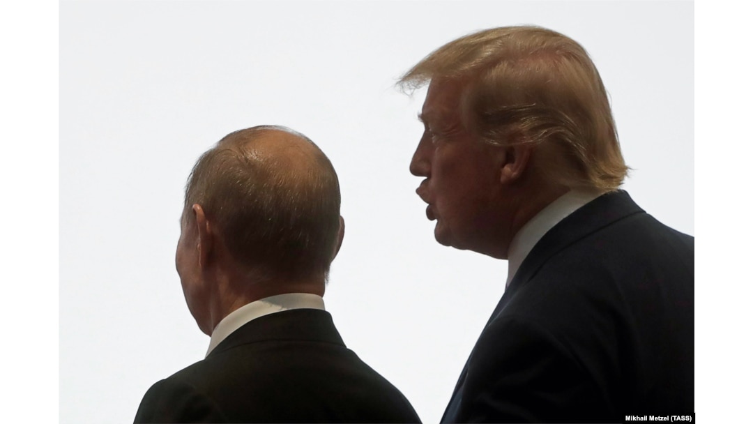 Vladimir Putin (left) and U.S. President Donald Trump talk to each other during the Group of Twenty leaders summit in Osaka, Japan, in June 2019.