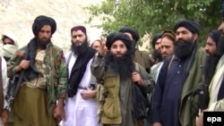 FILE: A video grab shows Mullah Fazlullah (C), the head of the Tehrik-e-Taliban Pakistan (TTP) at an undisclosed location at Pakistani-Afghan border.