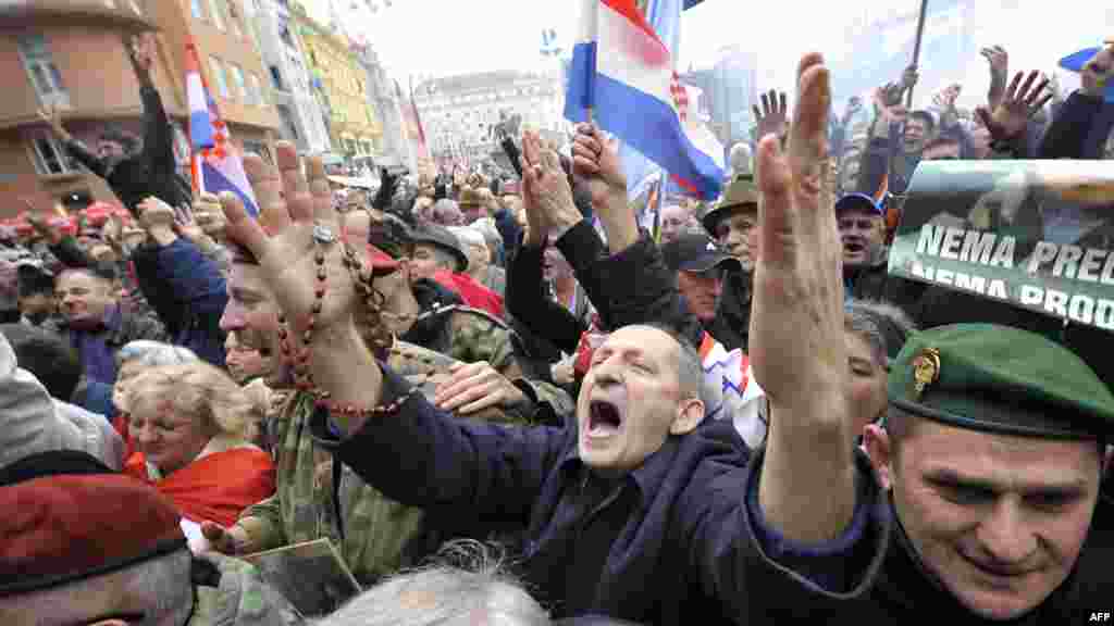 People in Zagreb cheer seconds after the UN war crimes court announced the acquittal of former Croatian generals Ante Gotovina and Mladen Markac on charges including war crimes. (AFP/Hrvoje Polan)