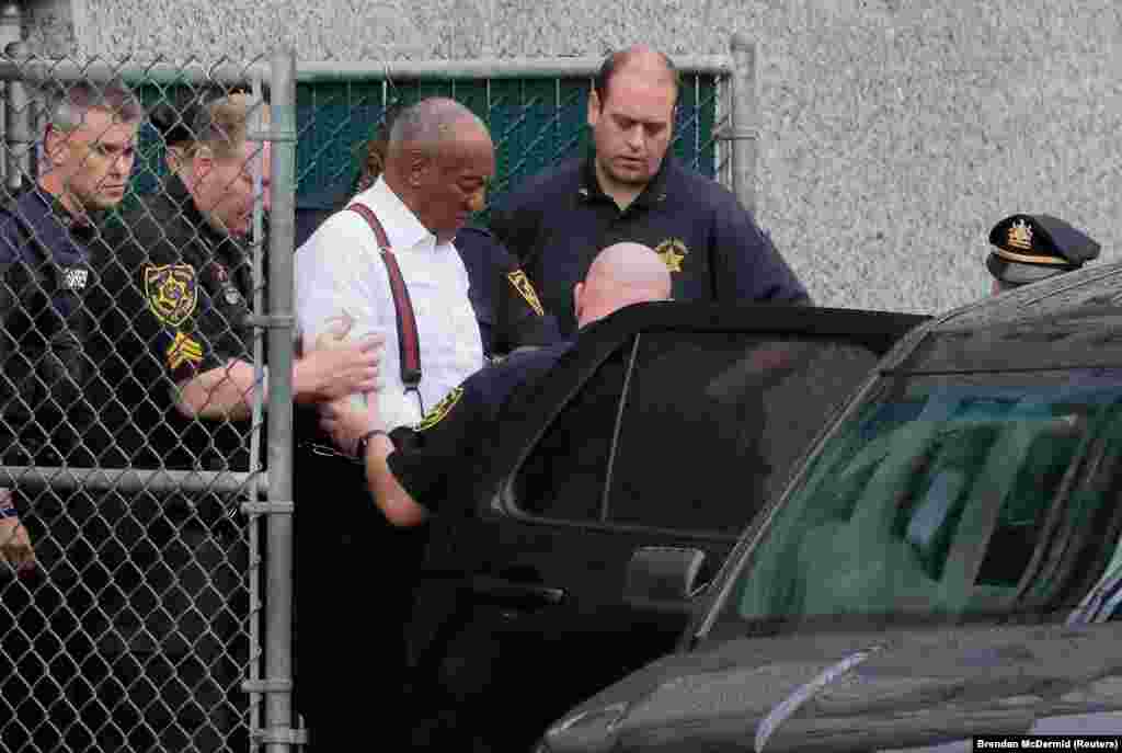 Actor and comedian Bill Cosby, 81, leaves a courthouse in handcuffs after receiving a three- to 10-year prison sentence in his sexual assault trial in Norristown, Pennsylvania, on September 25. (Reuters/Brendan McDermid)