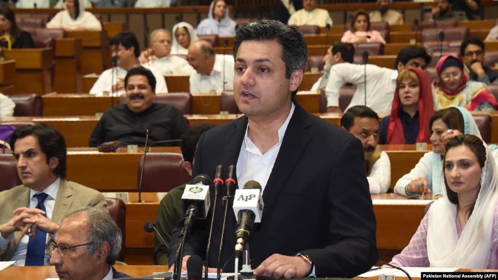 FILE: Hammad Azhar, Pakistan's minister of industries and production addressing the parliament in June 2019.
