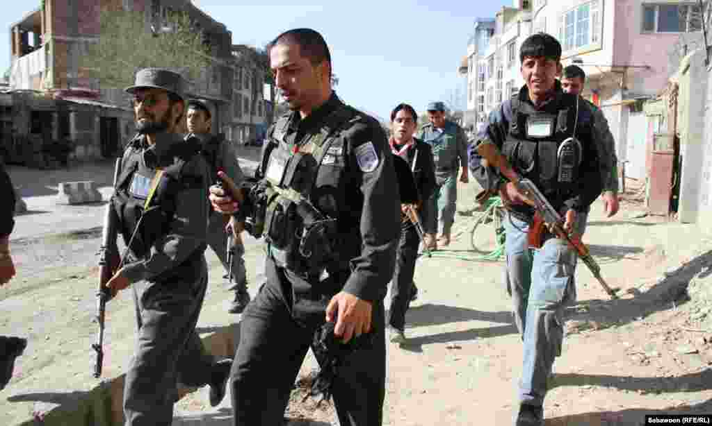 Police and security forces respond to the eruption of violence in Kabul on April 15. (Sayedjan Sabawoon/Radio Free Afghanistan)