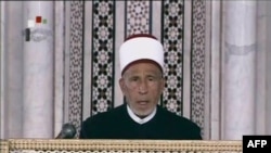 An image grab taken from state-run Syrian television on March 21 shows an archive video of senior cleric Muhammad al-Buti speaking during a religious ceremony at the historic Umayad Mosque in Damascus.