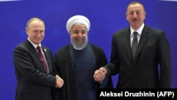 Russian President Vladimir Putin (left) last met with, Iranian President Hassan Rohani (center) and Azerbaijani President Ilham Aliyev (right) in November 2017. (file photo)