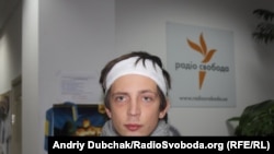 Polish journalist Paul Pyenonzhek says he was beaten by Ukrainian riot police on December 1.