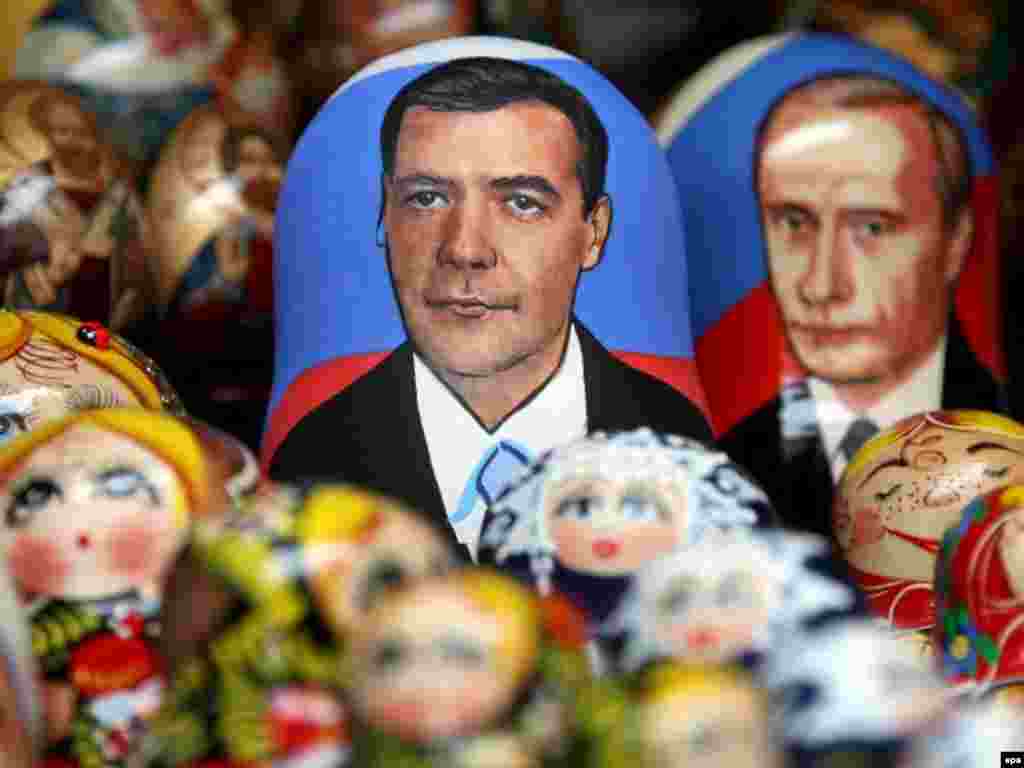 Nesting dolls bear the likenesses of Dmitry Medvedev and Vladimir Putin ahead of Russia's presidential election. - Matrioshka dolls whith the faces of Russian Deputy Prime Minister and presidential candidate Dmitry Medvedev (L) and Russian President Vladimir Putin (R) are displayed on the table of the street souvenir vendor in St.Petersburg.