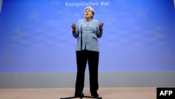 German Chancellor Angela Merkel speaks during a press conference after a meeting of European Union leaders in Brussels in late May.