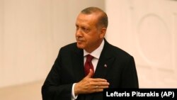 TURKEY -- Turkey's President Recep Tayyip Erdogan gestures at the parliament in Ankara, Turkey, Monday, July 9, 2018 when taking the oath of office for his second term as president