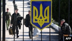 Ukrainian troops leaving the Belbek airbase, one day before Russian forces stormed the base on March 22.