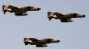 FILE PHOTO - Vietnam-era F-4 "Phantom" fighter jets fly during an annual military parade which marks Iran's eight-year war with Iraq, in Tehran, Sep. 22 2009