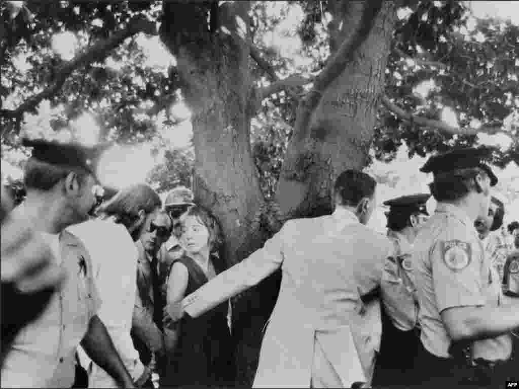In 1975, President Gerald Ford had guns drawn on him twice in one month. - On September 5, 1975, Lynette "Squeaky" Fromme (center left above) was subdued by a Secret Service agent after she pointed a pistol at Ford, who was visiting Sacramento, California. On September 22, 1975, Sara Jane Moore fired a single shot at Ford during a visit to San Francisco. The bullet missed Ford.
