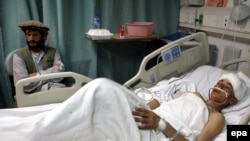 An Afghan boy injured in the rocket attack of 16 November lies in a hospital bed at a U.S. military base north of Kabul on November 17.