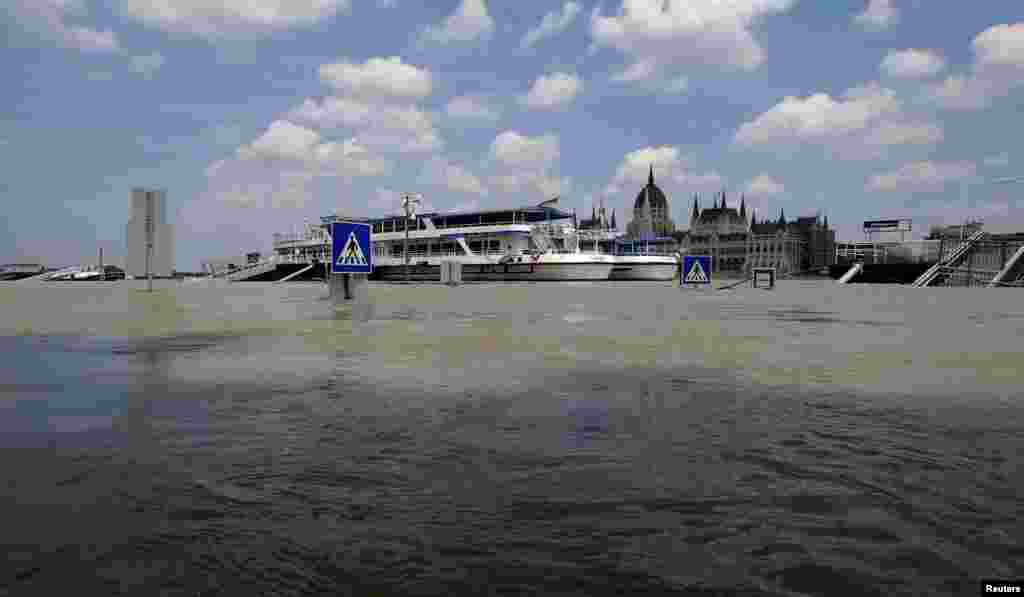 Traffic signs emerge from the swollen Danube River in Budapest. The river has reached record high levels in the Hungarian capital. (Reuters/Laszlo Balogh)