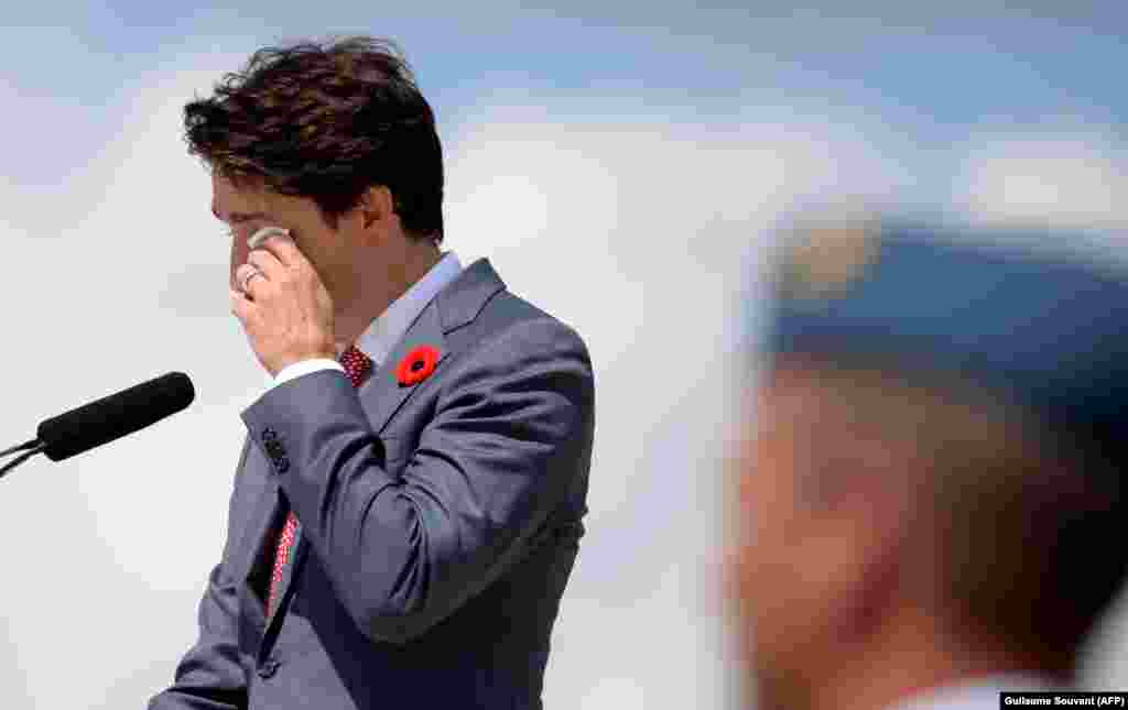 Canadian Prime Minister Justin Trudeau wipes a tear as he delivers a speech during the international ceremony on Juno Beach in Normandy, northwestern France, on June 6 as part of commemorations marking the 75th anniversary of the D-Day landings. (AFP/Guillaume Souvant)