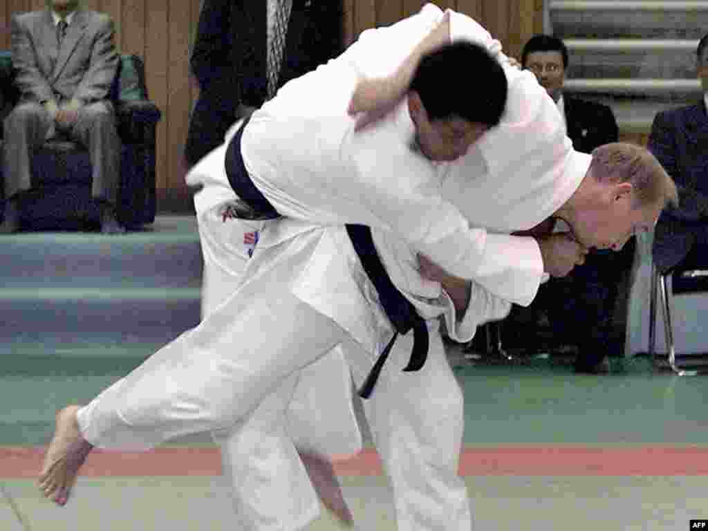 Putin throws a Japanese judo expert during an exhibition in Tokyo in September 2000.