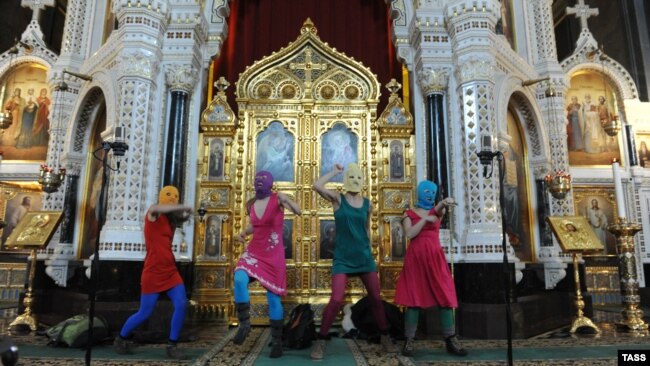 Russia -- Members of Pussy Riot sing a protest song against Vladimir Putin and the support of the Orthodox Church for him in Moscow'as main cathedral.
