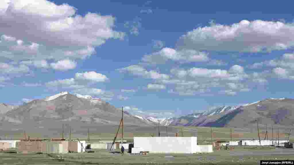 View of Аlichor village. The area is so high that 7,000-meter snow-capped peaks are seen as lowlying hills.