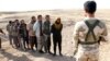 Kurdish Peshmerga forces detain Islamic State militants southwest of Kirkuk in October 2017. 