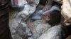 Jameel Mustafa Habboush, a young Syrian boy, receives oxygen as he is pulled from the rubble of a building following Russian air strikes on the rebel-held Fardous neighborhood of the embattled Syrian city of Aleppo. (AFP/Thaer Mohammed)