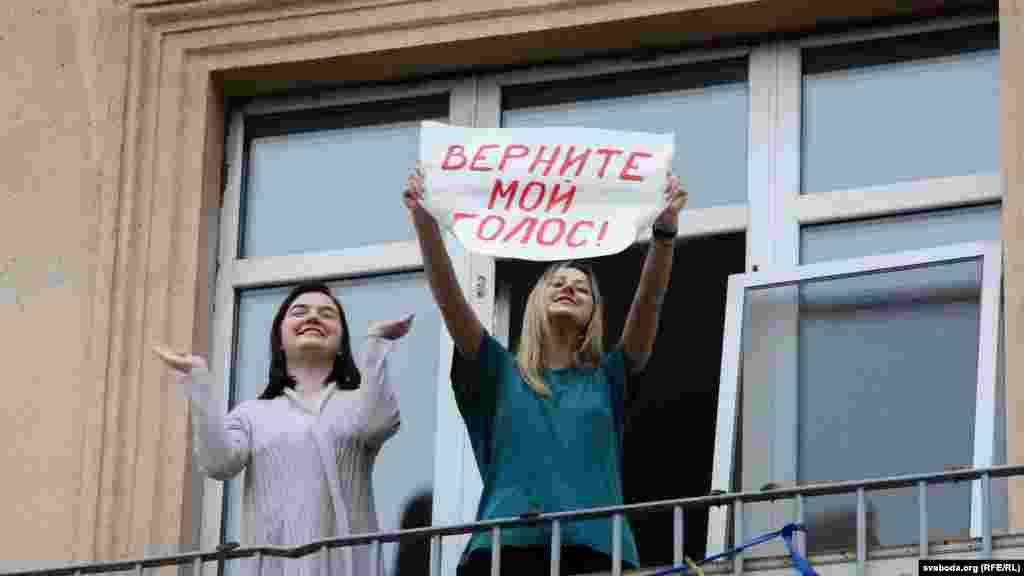 A protester holds up a sign that reads, &quot;Bring back my vote.&quot;