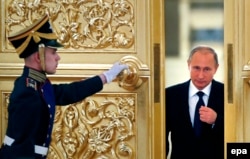 A guard of honor opens the door for Russian President Vladimir Putin at the Kremlin in Moscow. (file photo)