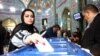 A woman casts her vote during parliamentary elections at a polling station in Tehran, Iran. February 21, 2020. 