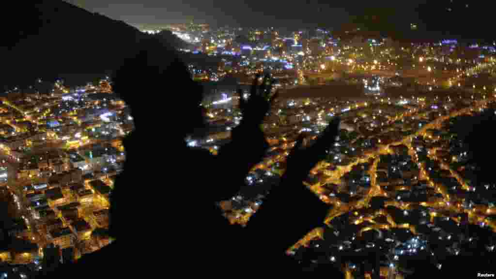 A Muslim pilgrim prays at Mount Al-Noor ahead of the annual haj pilgrimage in Mecca, on October 10. (Reuters/Ibraheem Abu Mustafa)