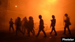 Riot police disperse protesters in Yerevan's Sari Tagh neighborhood late on July 29.