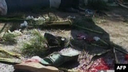 A screen grab from Iran's Arabic-language Al-Alam TV shows shoes and bloodstains at the site of a bomb that tore through an Iranian military parade in Mahabad on September 22.