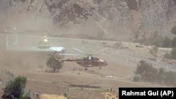 FILE: An Afghan national army helicopter lands in a remote part of Afghanistan.