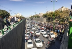 Motorists blocking a highway in Isfahan on the second day of protests, before security forces began attacking the peole.