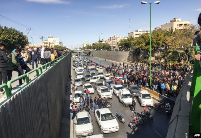 Motorists blocking a highway in Isfahan on the second day of protests, before security forces began attacking the peole.