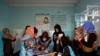 An Afghan election commission worker count ballots in Kabul on September 28