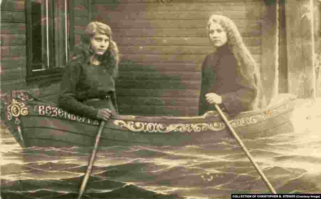 Steiner says it&#39;s impossible to know whether the pictures were viewed with humor in Russia, but the art-history professor notes that the urge for people to fake a scenario has never quite gone away, as these two young women paddle through what appears to be a flood.
